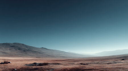 A stunning landscape featuring rolling hills and a clear blue sky at dawn, illustrating the beauty and serenity of nature in a tranquil and expansive terrain.の素材