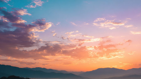 Stunning sunset over a majestic mountain range with exquisite colors blending in the sky. Ideal for conveying peacefulness, natural beauty, and outdoor adventures.の素材