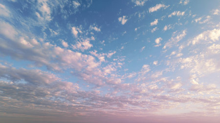A serene view of the sky filled with soft clouds, reflecting vibrant colors at sunset, perfect for nature themes. Captured in a picturesque landscape setting.の素材