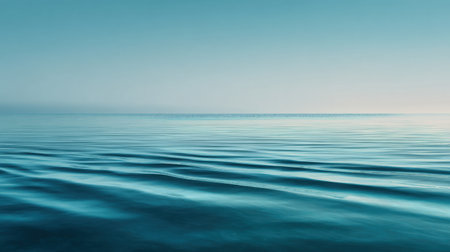 A tranquil ocean scene showcasing gentle waves under a clear blue sky. This image embodies peace and relaxation, perfect for travel and nature themes.の素材