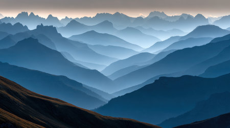 Captivating mountain landscape with soft blue hues and gentle fog, evoking a sense of tranquility. Perfect for travel, nature, and adventure themes.の素材