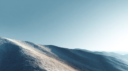 Breathtaking winter landscape featuring undulating snow-covered hills under a clear blue sky, perfect for evoking feelings of serenity and tranquility in nature.の素材
