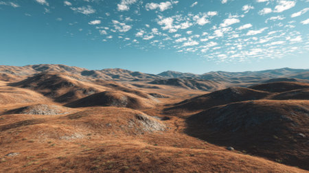 A stunning depiction of a vast dry landscape highlighted by rolling hills and a clear blue sky. The scene captures the tranquility and beauty of nature's expansive terrain.の素材