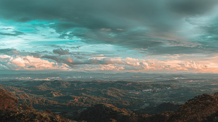 Captivating view of rolling hills intertwined with dramatic clouds above, showcasing nature's stunning colors and serenity, ideal for travel and outdoor themes.の素材
