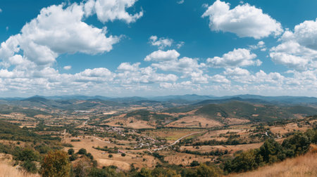 Discover the breathtaking beauty of rolling hills and valleys, a tranquil rural landscape showcasing natureの素材