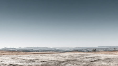 An expansive landscape featuring a mix of earth tones and a clear sky provides a sense of calm and tranquility, ideal for nature enthusiasts and photographers.の素材