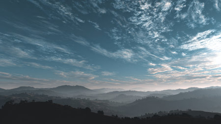 Capture the beauty of a serene landscape featuring rolling hills and a captivating sky, ideal for travel and nature themes that evoke tranquility and exploration.の素材