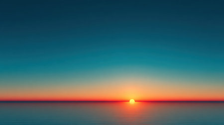 A stunning sunset over the ocean horizon, showcasing a blend of warm and cool colors in the sky. Perfect for promoting tranquility and relaxation in visual content.の素材