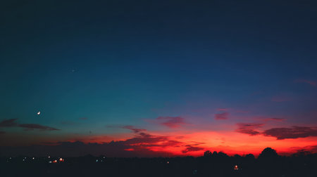 A captivating sunset scene showcases a harmonious blend of colors transitioning from radiant red to serene blue, encapsulating the beauty of twilight in nature.の素材