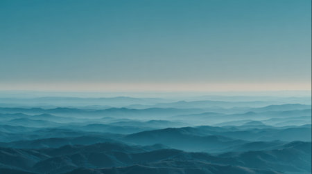 Captivating view of layered blue hills shrouded in soft mist, creating a tranquil atmosphere perfect for nature lovers and travel enthusiasts seeking serenity.の素材