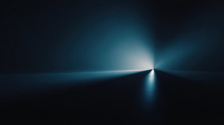 A tranquil scene featuring soft blue light gradually fading into darkness, creating a serene ambiance. Ideal for artistic expressions and abstract photography.の素材