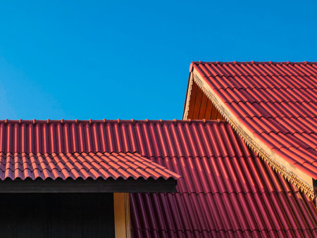 thai traditional roof tile against with blue sky