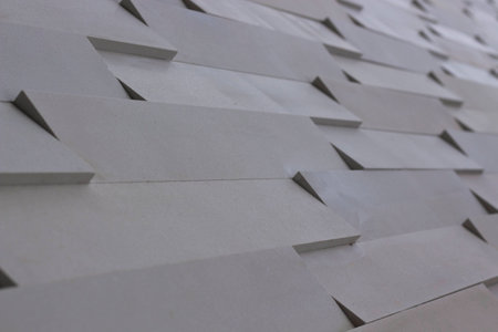 Light colored, modern stonework masonry.
