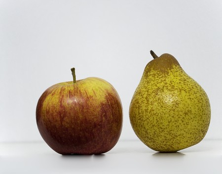 One Pear and one Apple isoleted over a white backgroudの写真素材