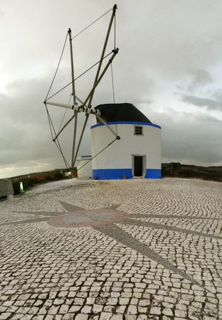 old windmill in Portugalの写真素材