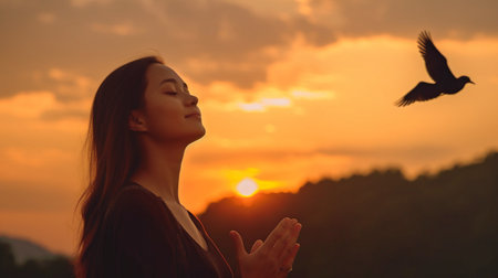 Hope idea with praying woman and free bird taking in the scenery against a sunset background. GENERATE AIの素材