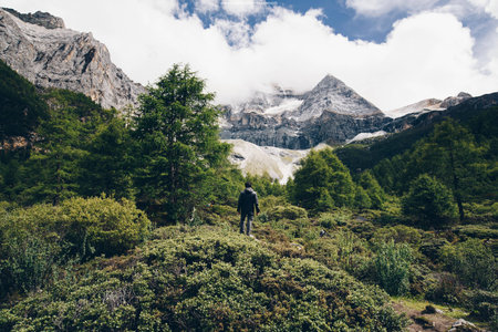 the one man stand front snow mountainの写真素材