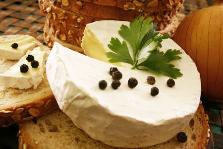 Bread and cheese on wooden board