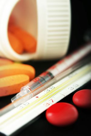 syringe and thermometer with medication