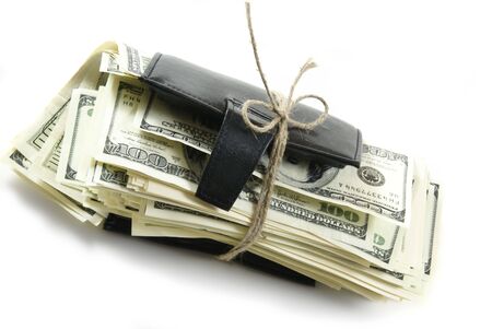 Leather wallet with some dollars inside on white backgroundの写真素材