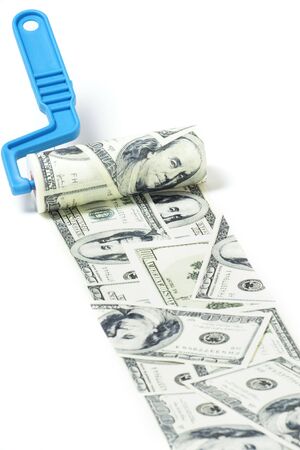 Abstract concept . Roller with dollar paint on white backgroundの写真素材