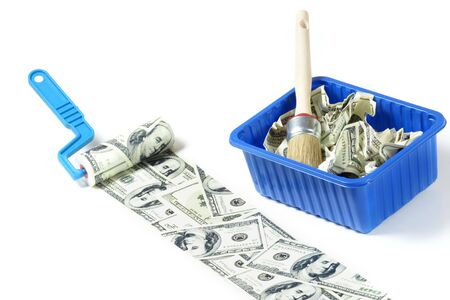 Abstract concept . Roller with dollar paint on white backgroundの写真素材