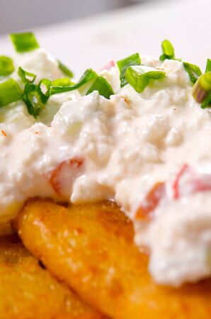 Cream cheese served with potato pancakes. Selective focus on chive.の写真素材