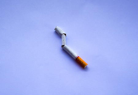 May 31, the day of non-smoking world, broken cigarette on a white background.