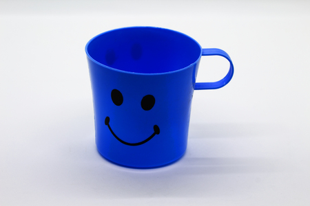 Blue Plastic Glass on White Backgroundの写真素材