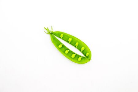 Green peas isolated white backgroundの写真素材