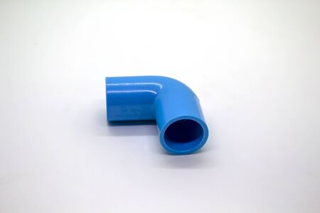Plastic joints for water pipes on a white background, spare equipmentの写真素材