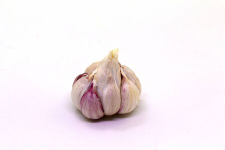 Garlic on a white background, used for cooking, universal foodの写真素材