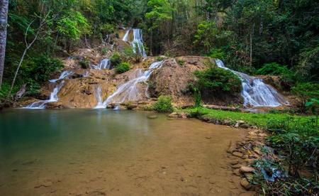 Waterfall in spring season located in deep rain forest jungle の写真素材