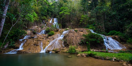 Waterfall in spring season located in deep rain forest jungle の写真素材
