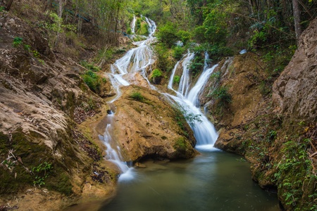 Water fall in spring season located in deep rain forest jungleの写真素材