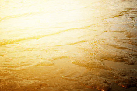 Twilight at the beach with small waves. colorful and soft tone.の写真素材