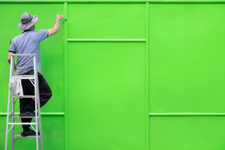 A man painted steel wall. Green wall.の写真素材
