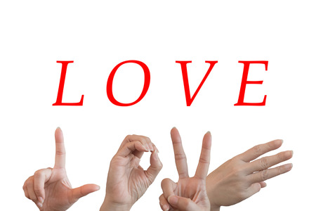 Hands trying to send symbols like alphabet the word love isolated on white background. Concepts and Ideas for Valentine's Day.の写真素材