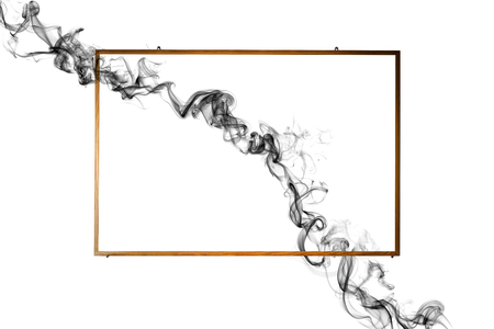 Wooden frame with dark smoke on white background.の写真素材