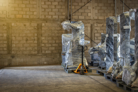 Old warehouses also have storage facilities. Old warehouses with pallets and some storage.の写真素材