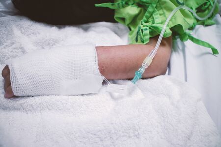 In the hospital's saline infusion for young children, it is necessary to put a soft taro to prevent the needle from loosening.の写真素材