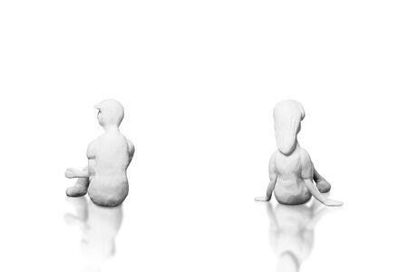 The statues from the white clay is a man and woman who is a lover or couple on a white background . Ideas about the day of love or valentine's day.の写真素材