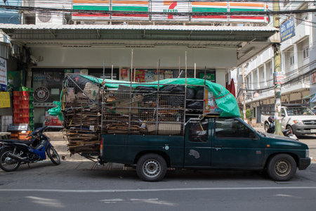BANGKOK, THAILAND - NOVEMBER 07:  Rama 3 Road on NOVEMBER 07, 2021 in Bangkok, Old pickup trucks loaded with used cardboard boxes parked in front of a convenience store. Bangkok, Thailand.のeditorial素材