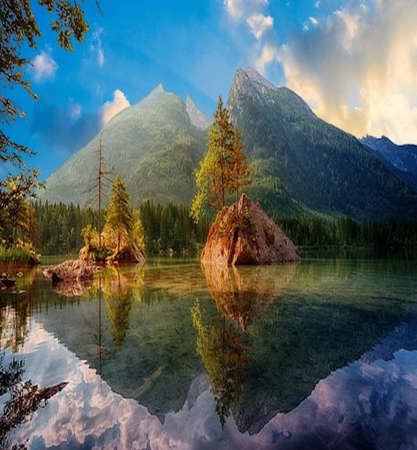 Clear lake waters and mountains of natural norway wonders.Silent glassy crystal clear waters of black lake in durmitor national park nature landscape reflecting green trees,の写真素材