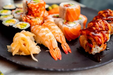 Rolls with salmon, caviar, shrimp, avocado, cucumber, wasabiの写真素材
