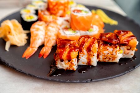 Rolls with salmon, caviar, shrimp, avocado, cucumber, wasabiの写真素材