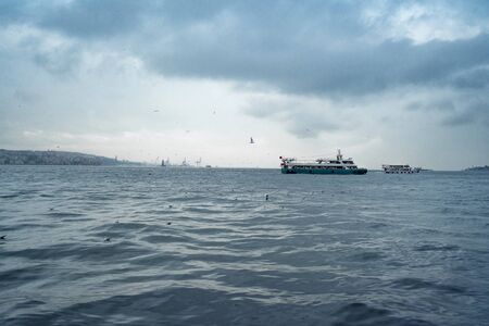 cold winter sea with ship Istanbul Turkeyの写真素材