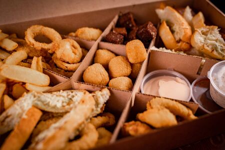 box assorted snacks deep-fried beer. Food for a holiday for a large company. The offer from the restaurant.の写真素材