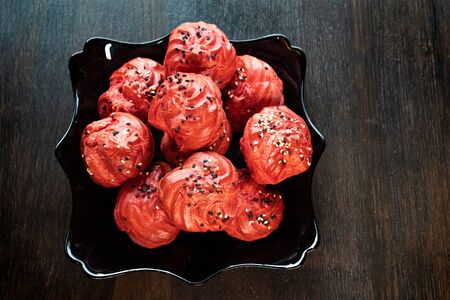 red appetizer for buffet of custard dough with filling. freespace
