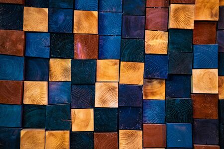 wooden cubes of different colors, background and texture.の写真素材